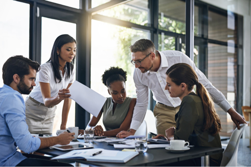 Payment Intelligence Industry Council - diverse business executives collaborating around conference table in modern office setting
